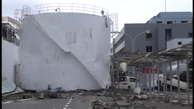 Heavy oil tank swept up by Tsunami