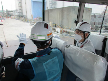 Viewing the Unit 2 turbine building from inside the bus