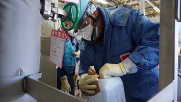 Sampling at the transfer facility (experts from Switzerland laboratories)